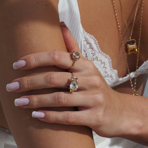 Gold Clear Quartz round solitaire ring with 4 small diamonds