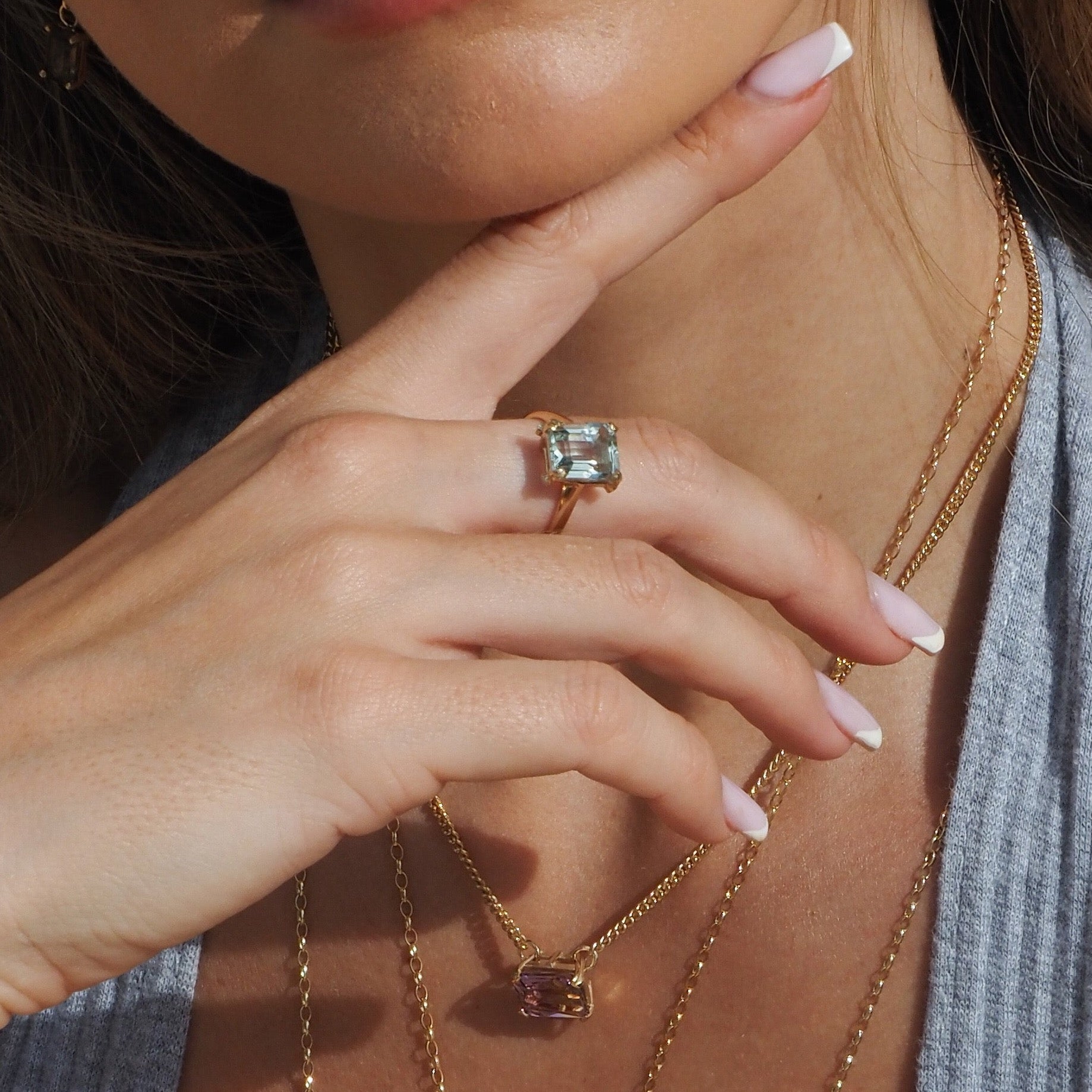 Gold ring with green amethyst solitaire and 4 small diamonds