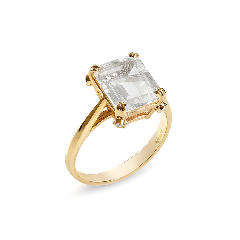 Gold ring with clear quartz solitaire and 4 small diamonds