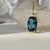 London Blue Topaz Amulet Necklace on Gold Chain